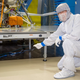 Bruce Banerdt pointing at a terrestrial seismometer installed directly under InSight’s seismometer to allow comparing simultaneous measurements.